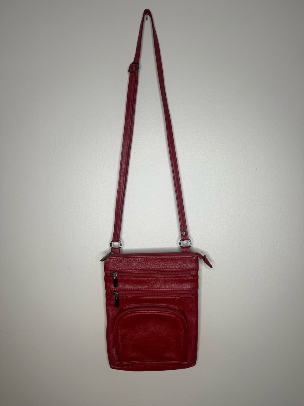 Classic Red Leather Crossbody Bag with Multiple Zip Pockets